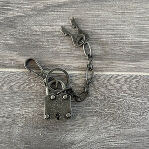 We the free silver Lock and Key Chain